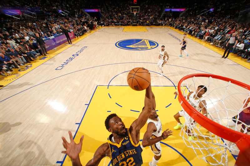 SAN FRANCISCO, CA - APRIL 12: Andrew Wiggins #22 of the Golden State Warriors grabs a rebound during the game against the New Orleans Pelicans on April 12, 2024 at Chase Center in San Francisco, California. NOTE TO USER: User expressly acknowledges and agrees that, by downloading and or using this photograph, user is consenting to the terms and conditions of Getty Images License Agreement. Mandatory Copyright Notice: Copyright 2024 NBAE (Photo by Jed Jacobsohn/NBAE via Getty Images)