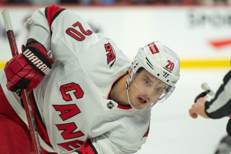 Dec 12, 2023; Ottawa, Ontario, CAN; Carolina Hurricanes center Sebastian Aho (20) follows the puck on a faceoff in the first period against the Ottawa Senators at the Canadian Tire Centre. Mandatory Credit: Marc DesRosiers-USA TODAY Sports