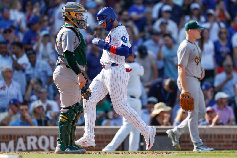 Sep 18, 2024; Chicago, Illinois, USA; Chicago Cubs catcher Miguel Amaya (9) scores against the Oakland Athletics during the fifth inning at Wrigley Field. Mandatory Credit: Kamil Krzaczynski-Imagn Images