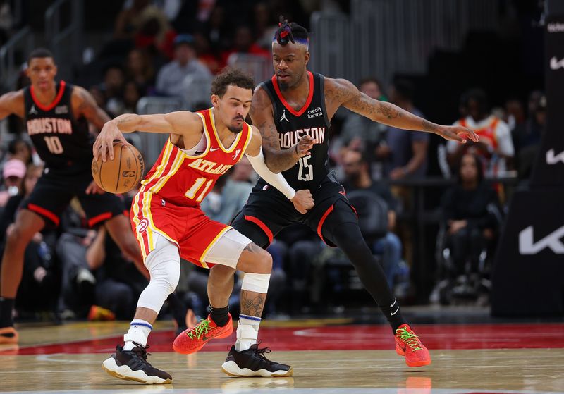 ATLANTA, GEORGIA - FEBRUARY 10:  Trae Young #11 of the Atlanta Hawks is defended by Reggie Bullock Jr. #25 of the Houston Rockets during the fourth quarter at State Farm Arena on February 10, 2024 in Atlanta, Georgia.  NOTE TO USER: User expressly acknowledges and agrees that, by downloading and/or using this photograph, user is consenting to the terms and conditions of the Getty Images License Agreement.  (Photo by Kevin C. Cox/Getty Images)