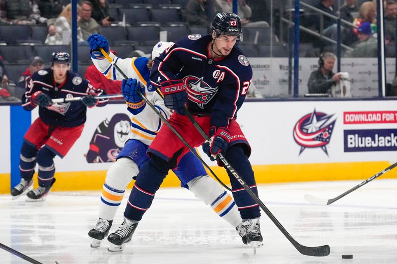 Oct 17, 2024; Columbus, Ohio, USA; Columbus Blue Jackets center Sean Monahan (23) passes the puck against the Buffalo Sabres in the third period at Nationwide Arena on Thursday. Mandatory Credit: Samantha Madar/USA TODAY Network via Imagn Images