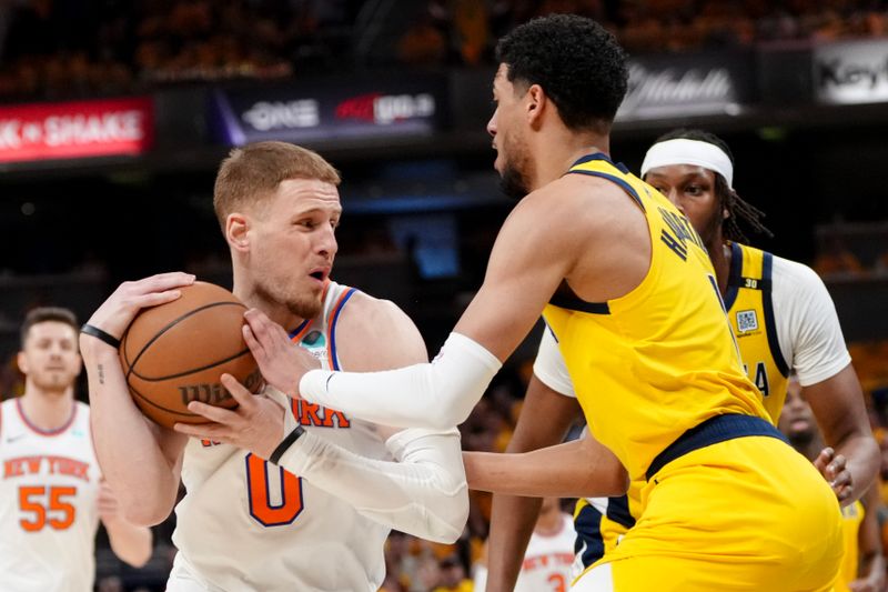 INDIANAPOLIS, INDIANA - MAY 17: Donte DiVincenzo #0 of the New York Knicks drives to the basket against Tyrese Haliburton #0 of the Indiana Pacers during the first quarter in Game Six of the Eastern Conference Second Round Playoffs at Gainbridge Fieldhouse on May 17, 2024 in Indianapolis, Indiana. NOTE TO USER: User expressly acknowledges and agrees that, by downloading and or using this photograph, User is consenting to the terms and conditions of the Getty Images License Agreement. (Photo by Dylan Buell/Getty Images)