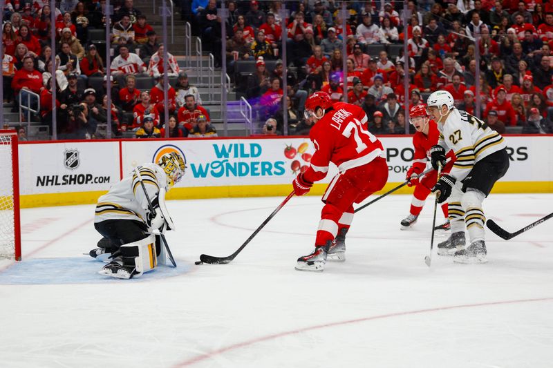 Dec 31, 2023; Detroit, Michigan, USA; Detroit Red Wings center Dylan Larkin (71) takes a shot on Boston Bruins goaltender Jeremy Swayman (1) during the second period of the game between the Boston Bruins and the Detroit Red Wings at Little Caesars Arena. Mandatory Credit: Brian Bradshaw Sevald-USA TODAY Sports