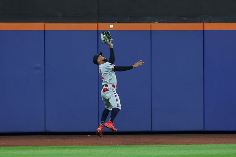 Jul 30, 2024; New York City, New York, USA; Minnesota Twins center fielder Byron Buxton (25) catches a fly ball by New York Mets catcher Luis Torrens (not pictured) during the fifth inning at Citi Field. Mandatory Credit: Brad Penner-USA TODAY Sports