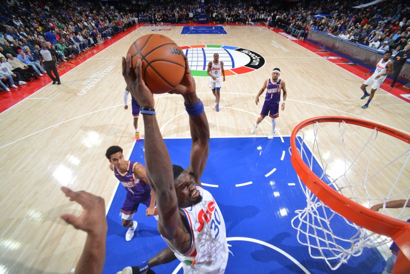 PHILADELPHIA, PA - JANUARY 6: Adem Bona #30 of the Philadelphia 76ers dunks the ball during the game against the Phoenix Suns on January 6, 2025 at the Wells Fargo Center in Philadelphia, Pennsylvania NOTE TO USER: User expressly acknowledges and agrees that, by downloading and/or using this Photograph, user is consenting to the terms and conditions of the Getty Images License Agreement. Mandatory Copyright Notice: Copyright 2025 NBAE (Photo by Jesse D. Garrabrant/NBAE via Getty Images)