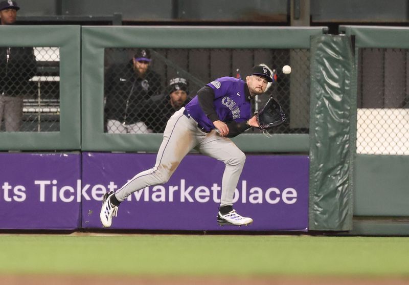 May 2, 2025; San Francisco, California, USA; Colorado Rockies center fielder Brenton Doyle (9) catches the ball against the San Francisco Giants during the sixth inning at Oracle Park. Mandatory Credit: Kelley L Cox-Imagn Images