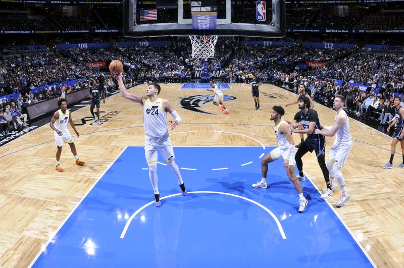 ORLANDO, FL - JANUARY 5 :  Walker Kessler #24 of the Utah Jazz goes up for the rebound during the game against the Orlando Magic on January 5, 2025 at Kia Center in Orlando, Florida. NOTE TO USER: User expressly acknowledges and agrees that, by downloading and or using this photograph, User is consenting to the terms and conditions of the Getty Images License Agreement. Mandatory Copyright Notice: Copyright 2025 NBAE (Photo by Fernando Medina/NBAE via Getty Images)