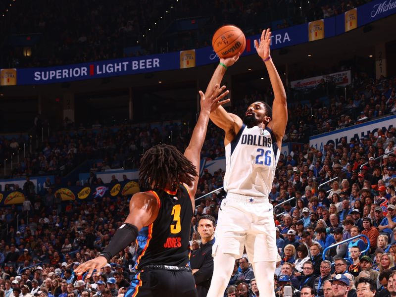 OKLAHOMA CITY, OK - NOVEMBER 17: Spencer Dinwiddie #26 of the Dallas Mavericks shoots a three point basket during the game against the Oklahoma City Thunder on November 17, 2024 at Paycom Center in Oklahoma City, Oklahoma. NOTE TO USER: User expressly acknowledges and agrees that, by downloading and or using this photograph, User is consenting to the terms and conditions of the Getty Images License Agreement. Mandatory Copyright Notice: Copyright 2024 NBAE (Photo by Zach Beeker/NBAE via Getty Images)