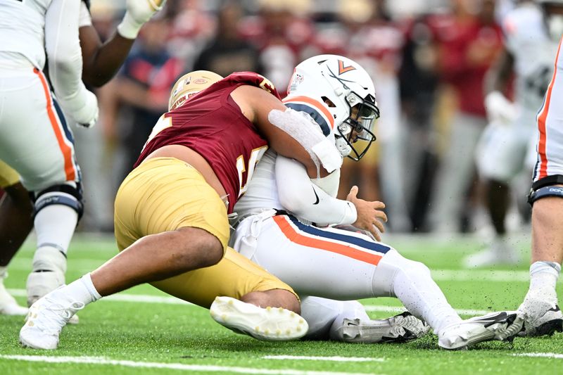 Sep 30, 2023; Chestnut Hill, Massachusetts, USA; Boston College Eagles defensive lineman George Rooks (91) sacks Virginia Cavaliers quarterback Tony Muskett (11) during the second half at Alumni Stadium. Mandatory Credit: Brian Fluharty-USA TODAY Sports