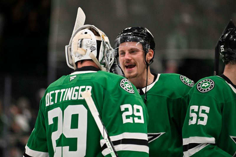 Oct 15, 2024; Dallas, Texas, USA; Dallas Stars goaltender Jake Oettinger (29) and center Roope Hintz (24) celebrate the Stars victory over the San Jose Sharks at the American Airlines Center. Mandatory Credit: Jerome Miron-Imagn Images