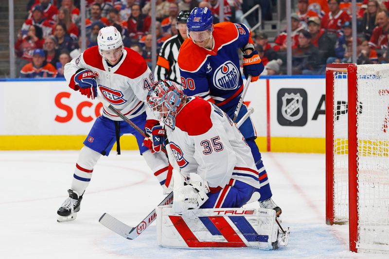 Mar 6, 2025; Edmonton, Alberta, CAN; Edmonton Oilers forward Corey Perry (90) looks for a loose puck in front of Montreal Canadiens goaltender Sam Montembeault (35)during the third period at Rogers Place. Mandatory Credit: Perry Nelson-Imagn Images