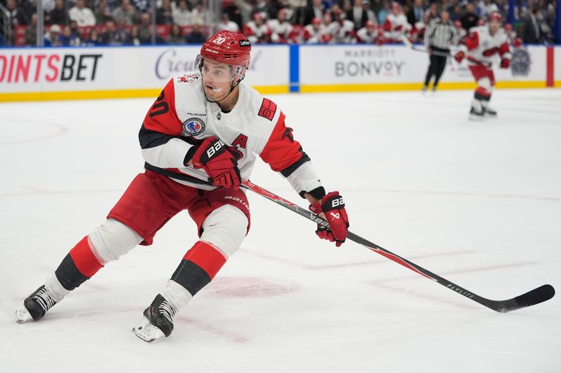 Nov 9, 2025; Toronto, Ontario, CAN; Carolina Hurricanes forward Sebastian Aho (20) skates against the Toronto Maple Leafs during the second period at Scotiabank Arena. Mandatory Credit: John E. Sokolowski-Imagn Images