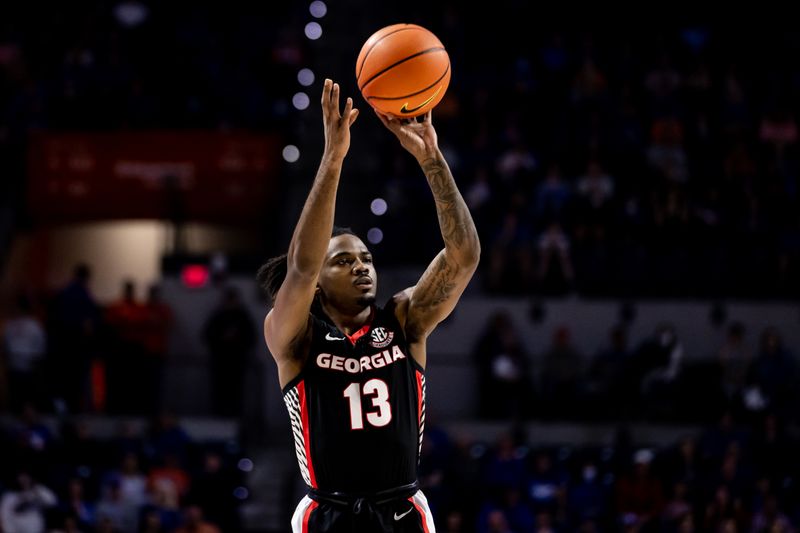 Jan 7, 2023; Gainesville, Florida, USA; Georgia Bulldogs guard Mardrez McBride (13) shoots the ball during the first half against the Florida Gators at Exactech Arena at the Stephen C. O'Connell Center. Mandatory Credit: Matt Pendleton-USA TODAY Sports