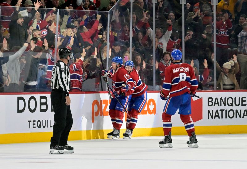 Nov 1, 2025; Montreal, Quebec, CAN; Montreal Canadiens forward Alex Newhook (15) celebrates with teammates after scoring the winning goal against the Ottawa Senators during the overtime period at the Bell Centre. Mandatory Credit: Eric Bolte-Imagn Images