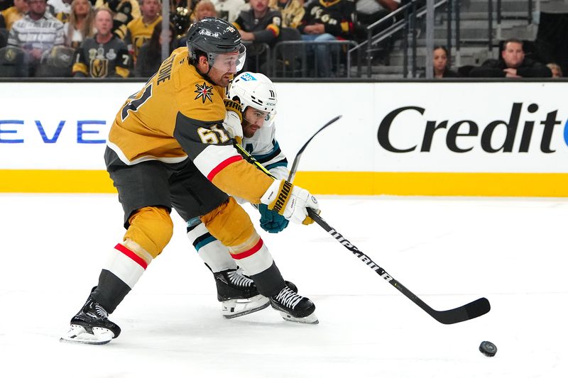 Oct 26, 2024; Las Vegas, Nevada, USA; Vegas Golden Knights right wing Mark Stone (61) shoots as he takes a slash from San Jose Sharks center Luke Kunin (11) during the second period at T-Mobile Arena. Mandatory Credit: Stephen R. Sylvanie-Imagn Images