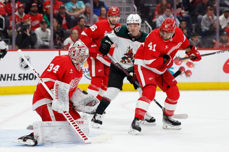 Mar 14, 2024; Detroit, Michigan, USA;  Detroit Red Wings goaltender Alex Lyon (34) makes a save in the first period against the Arizona Coyotes at Little Caesars Arena. Mandatory Credit: Rick Osentoski-USA TODAY Sports