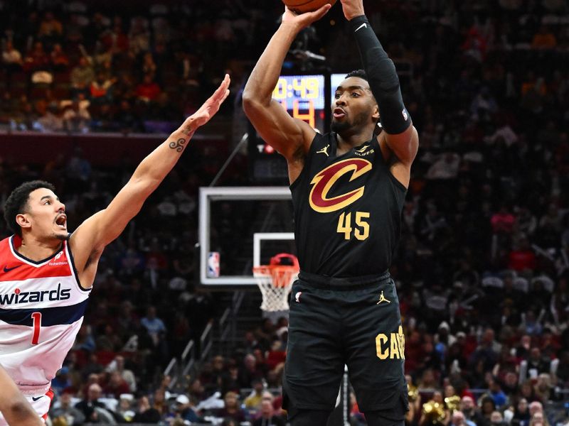 CLEVELAND, OHIO - DECEMBER 03: Donovan Mitchell #45 of the Cleveland Cavaliers shoots over Johnny Davis #1 of the Washington Wizards during the second half at Rocket Mortgage Fieldhouse on December 03, 2024 in Cleveland, Ohio. The Cavaliers defeated the Wizards 118-87. NOTE TO USER: User expressly acknowledges and agrees that, by downloading and or using this photograph, User is consenting to the terms and conditions of the Getty Images License Agreement. (Photo by Jason Miller/Getty Images)