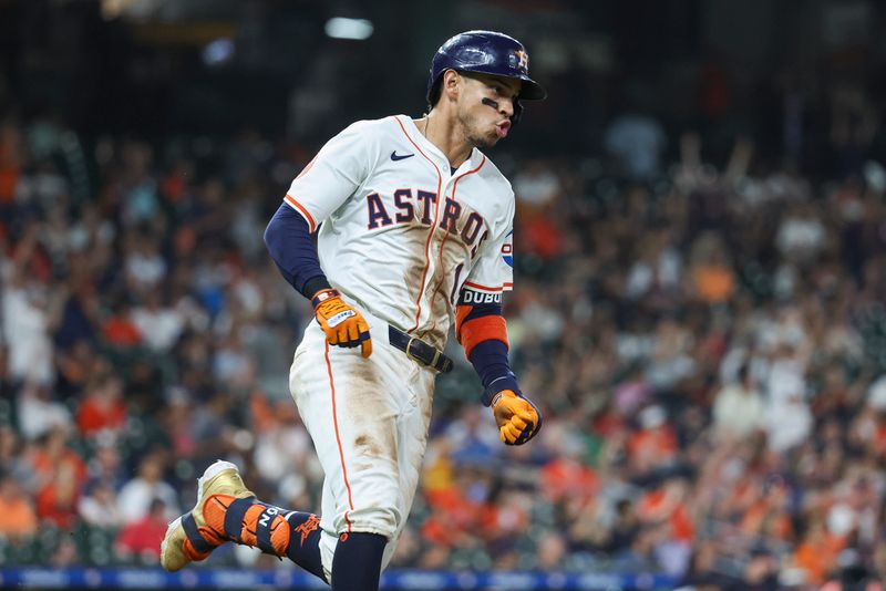 May 1, 2024; Houston, Texas, USA;  Houston Astros center fielder Mauricio Dubon (14) runs to first base on a double during the eighth inning against the Cleveland Guardians at Minute Maid Park. Mandatory Credit: Troy Taormina-USA TODAY Sports