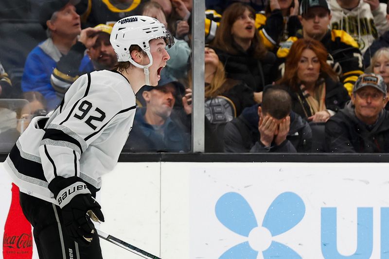 Feb 17, 2024; Boston, Massachusetts, USA; As fans react, Los Angeles Kings defenseman Brandt Clarke (92) celebrates his game winning goal in overtime that defeated the Boston Bruins 5-4 at TD Garden. Mandatory Credit: Winslow Townson-USA TODAY Sports