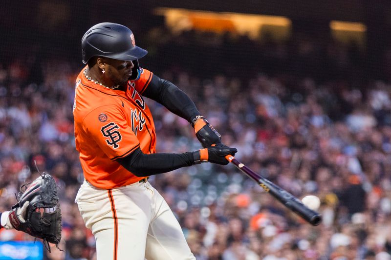 Jul 12, 2024; San Francisco, California, USA; San Francisco Giants designated hitter Jorge Soler (2) hits an RBI single against the Minnesota Twins during the fifth inning at Oracle Park. Mandatory Credit: John Hefti-USA TODAY Sports