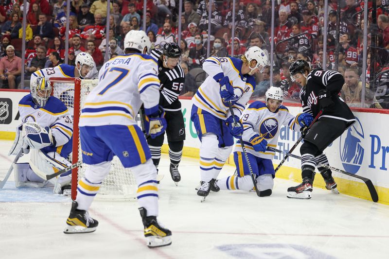 Oct 27, 2023; Newark, New Jersey, USA; Buffalo Sabres defenseman Rasmus Dahlin (26) and center Peyton Krebs (19) battle with New Jersey Devils left wing Erik Haula (56) an center Dawson Mercer (91) for the puck during the first period  at Prudential Center. Mandatory Credit: Vincent Carchietta-USA TODAY Sports