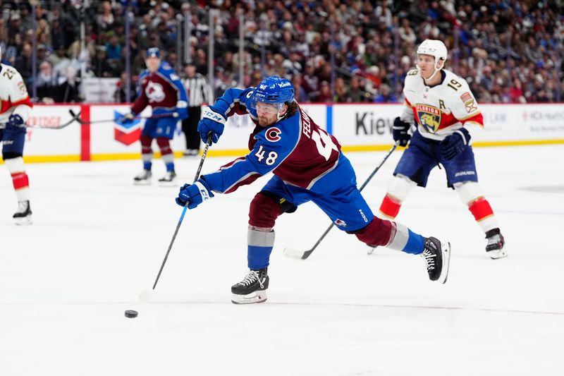Jan 6, 2025; Denver, Colorado, USA; Colorado Avalanche left wing Tye Felhaber (48) shoots the puck in the second period against the Florida Panthers at Ball Arena. Mandatory Credit: Ron Chenoy-Imagn Images