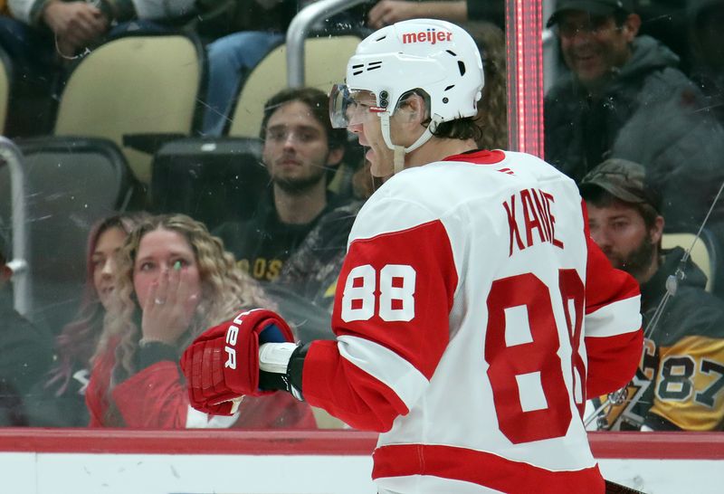 Nov 13, 2024; Pittsburgh, Pennsylvania, USA;  Detroit Red Wings right wing Patrick Kane (88) reacts after scoring a goal against the Pittsburgh Penguins during the second period at PPG Paints Arena. Mandatory Credit: Charles LeClaire-Imagn Images