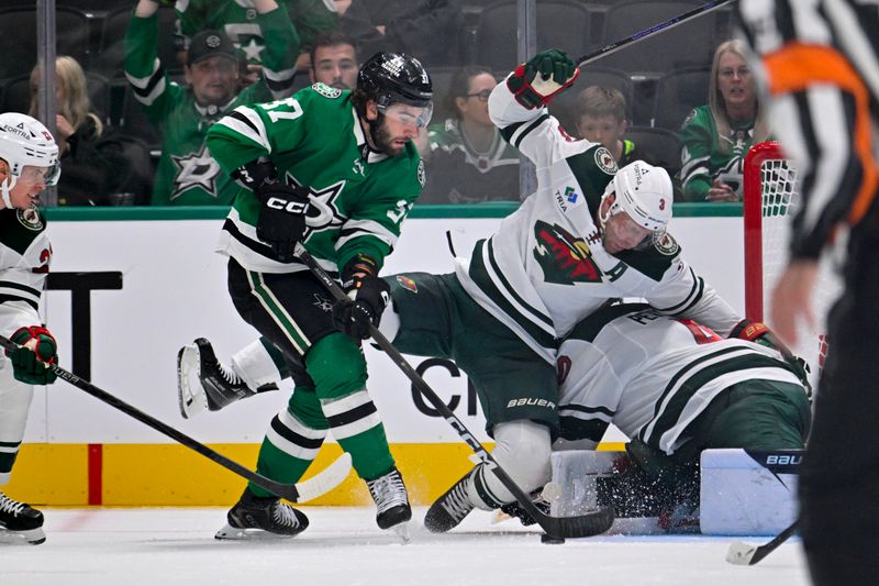 Sep 23, 2025; Dallas, Texas, USA; Dallas Stars center Harrison Scott (37) attempts to poke the puck past Minnesota Wild defenseman Jack Johnson (3) during the third period at American Airlines Center. Mandatory Credit: Jerome Miron-Imagn Images