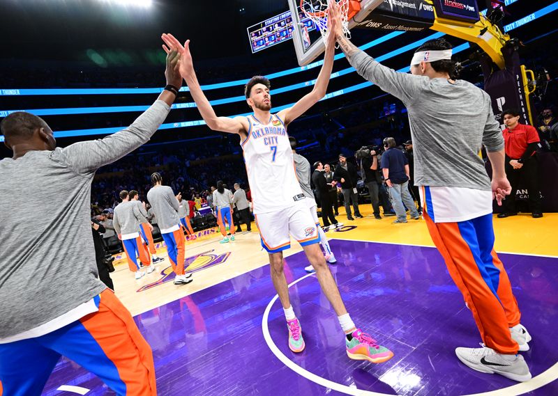 LOS ANGELES, CA - MARCH 4: Chet Holmgren #7 of the Oklahoma City Thunder high fives before the game against the Los Angeles Lakers on March 4, 2024 at Crypto.Com Arena in Los Angeles, California. NOTE TO USER: User expressly acknowledges and agrees that, by downloading and/or using this Photograph, user is consenting to the terms and conditions of the Getty Images License Agreement. Mandatory Copyright Notice: Copyright 2024 NBAE (Photo by Adam Pantozzi/NBAE via Getty Images)