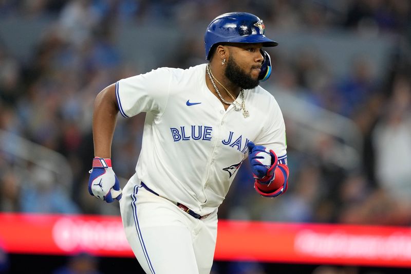 Jun 27, 2024; Toronto, Ontario, CAN; Toronto Blue Jays first baseman Vladimir Guerrero Jr. (27) runs to first base on a solo home run against the New York Yankees during the sixth inning at Rogers Centre. Mandatory Credit: John E. Sokolowski-USA TODAY Sports