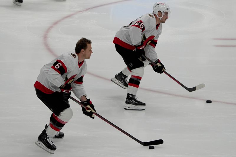 Feb 19, 2024; Tampa, Florida, USA; Ottawa Senators defenseman Jakob Chychrun (6) and defenseman Erik Brannstrom (26) warm up before the Senators take on the Tampa Bay Lightning at Amalie Arena. Mandatory Credit: Dave Nelson-USA TODAY Sports