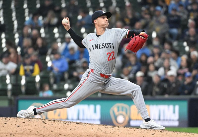 Apr 3, 2024; Milwaukee, Wisconsin, USA; Minnesota Twins relief pitcher Griffin Jax (22) delivers a pitch against the Milwaukee Brewers in the eighth inning at American Family Field. Mandatory Credit: Michael McLoone-USA TODAY Sports