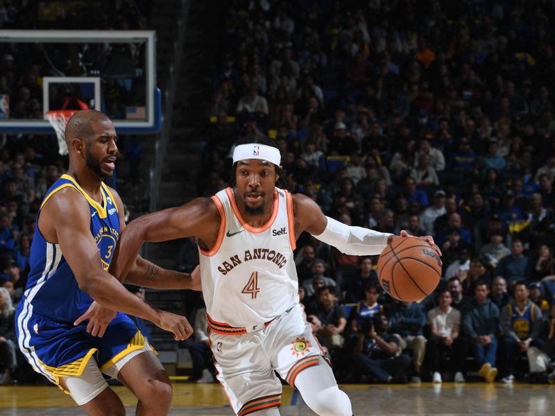 SAN FRANCISCO, CA - MARCH 9: Devonte Graham #4 of the San Antonio Spurs dribbles the ball during the game against the Golden State Warriors on MARCH 9, 2024 at Chase Center in San Francisco, California. NOTE TO USER: User expressly acknowledges and agrees that, by downloading and or using this photograph, user is consenting to the terms and conditions of Getty Images License Agreement. Mandatory Copyright Notice: Copyright 2024 NBAE (Photo by Noah Graham/NBAE via Getty Images)