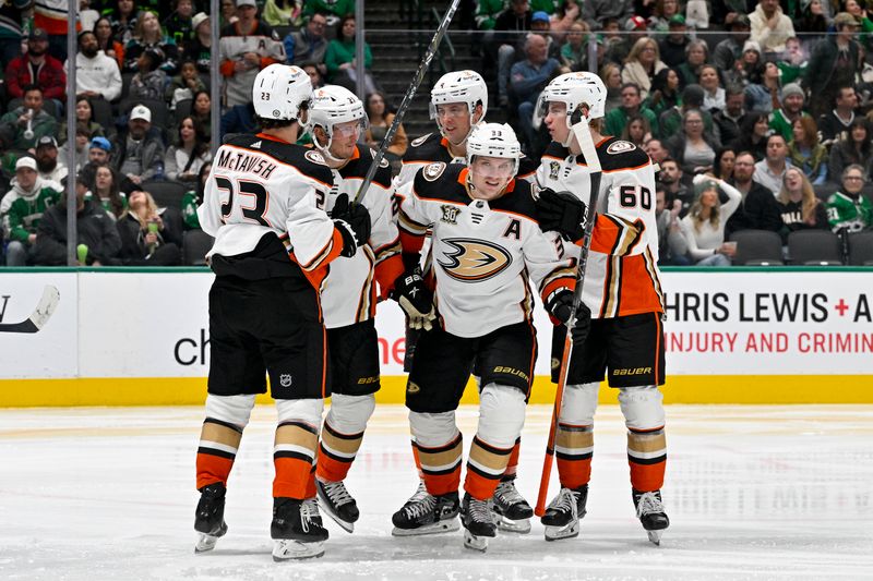 Jan 25, 2024; Dallas, Texas, USA; Anaheim Ducks center Mason McTavish (23) and center Isac Lundestrom (21) and defenseman Cam Fowler (4) and right wing Jakob Silfverberg (33) and defenseman Jackson LaCombe (60) celebrates a goal scored by Silfverberg against the Dallas Stars during the third period at the American Airlines Center. Mandatory Credit: Jerome Miron-USA TODAY Sports