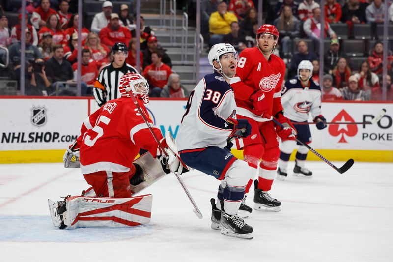 Nov 11, 2023; Detroit, Michigan, USA;  Columbus Blue Jackets center Boone Jenner (38) tries to screen Detroit Red Wings goaltender Ville Husso (35) in the first period at Little Caesars Arena. Mandatory Credit: Rick Osentoski-USA TODAY Sports