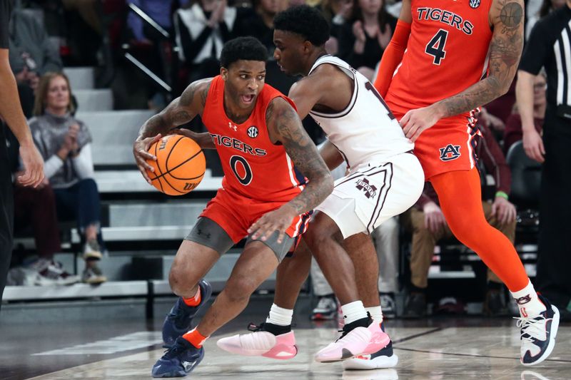 Jan 27, 2024; Starkville, Mississippi, USA; Auburn Tigers guard K.D. Johnson (0) dribbles around a screen as Mississippi State Bulldogs guard Josh Hubbard (13) defends during the second half at Humphrey Coliseum. Mandatory Credit: Petre Thomas-USA TODAY Sports