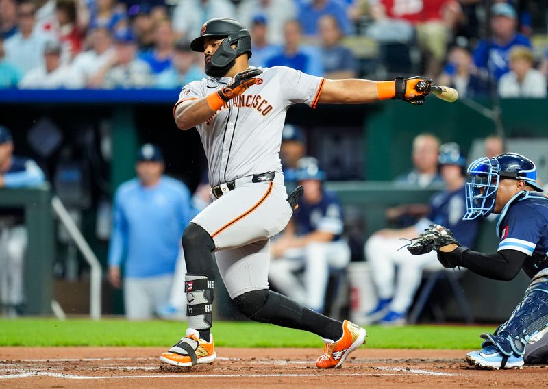 Sep 20, 2024; Kansas City, Missouri, USA; San Francisco Giants left fielder Heliot Ramos (17) hits an RBI single during the first inning against the Kansas City Royals at Kauffman Stadium. Mandatory Credit: Jay Biggerstaff-Imagn Images