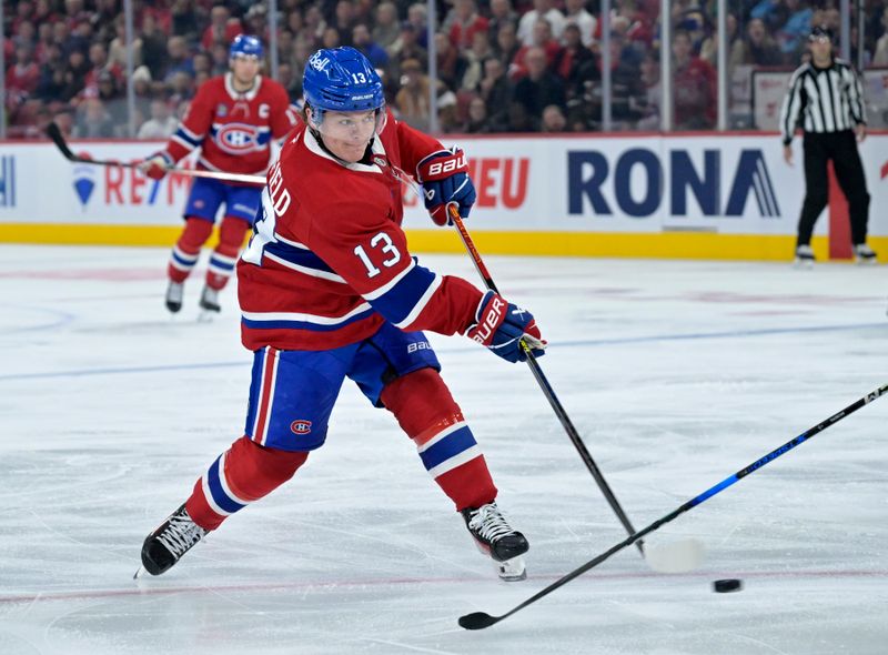 Oct 26, 2024; Montreal, Quebec, CAN; Montreal Canadiens forward Cole Caufield (13) scores a goal against the St.Louis Blues during the third period at the Bell Centre. Mandatory Credit: Eric Bolte-Imagn Images