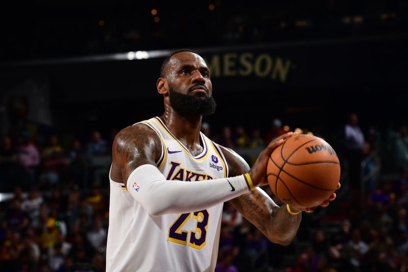 PHOENIX, AZ - FEBRUARY 25: LeBron James #23 of the Los Angeles Lakers shoots a free throw during the game against the Phoenix Suns on February 25, 2024 at Footprint Center in Phoenix, Arizona. NOTE TO USER: User expressly acknowledges and agrees that, by downloading and or using this photograph, user is consenting to the terms and conditions of the Getty Images License Agreement. Mandatory Copyright Notice: Copyright 2024 NBAE (Photo by Kate Frese/NBAE via Getty Images)