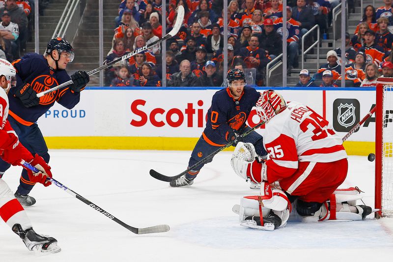 Feb 15, 2023; Edmonton, Alberta, CAN; Edmonton Oilers forward Klim Kostin (21) hits the goal post behind Detroit Red Wings goaltender Ville Husso (35) during the first period at Rogers Place. Mandatory Credit: Perry Nelson-USA TODAY Sports