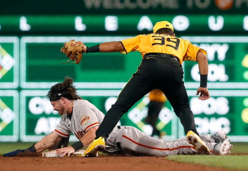 Jul 14, 2023; Pittsburgh, Pennsylvania, USA;  Pittsburgh Pirates second baseman Nick Gonzales (39) tags out San Francisco Giants pinch runner Brett Wisely (70) attempting to steal second base during the ninth inning at PNC Park. The Giants won 6-4. Mandatory Credit: Charles LeClaire-USA TODAY Sports