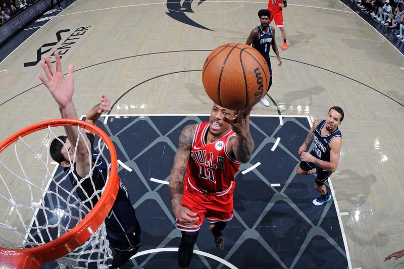 ORLANDO, FL - FEBRUARY 10: DeMar DeRozan #11 of the Chicago Bulls shoots the ball during the game against the Orlando Magic on February 10, 2024 at the Kia Center in Orlando, Florida. NOTE TO USER: User expressly acknowledges and agrees that, by downloading and or using this photograph, User is consenting to the terms and conditions of the Getty Images License Agreement. Mandatory Copyright Notice: Copyright 2024 NBAE (Photo by Fernando Medina/NBAE via Getty Images)