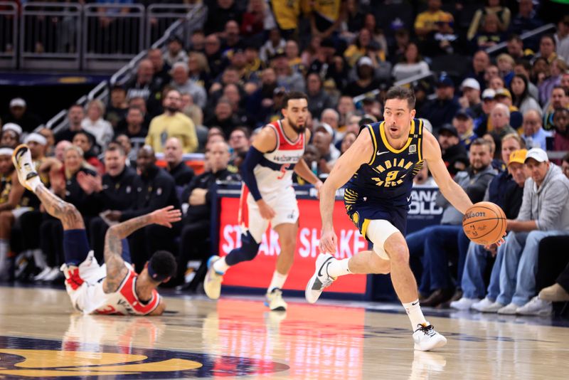 INDIANAPOLIS, INDIANA - JANUARY 10: T.J. McConnell #9 of the Indiana Pacers  brings the ball up court during the first half against the Washington Wizards at Gainbridge Fieldhouse on January 10, 2024 in Indianapolis, Indiana. NOTE TO USER: User expressly acknowledges and agrees that, by downloading and or using this photograph, User is consenting to the terms and conditions of the Getty Images License Agreement. (Photo by Justin Casterline/Getty Images)