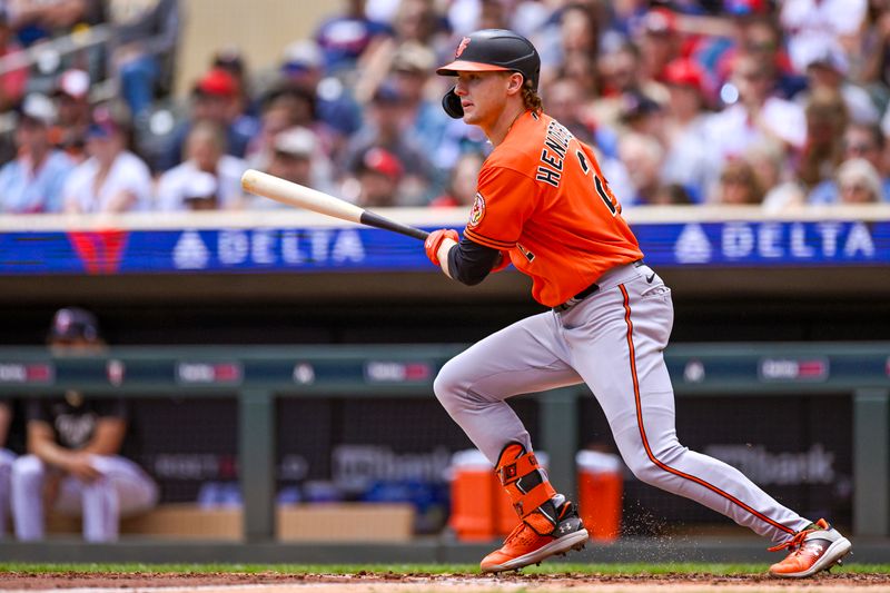 Jul 8, 2023; Minneapolis, Minnesota, USA;  Baltimore Orioles infielder Gunnar Henderson (2) hits an RBI single against the Minnesota Twins during the second inning at Target Field. Mandatory Credit: Nick Wosika-USA TODAY Sports