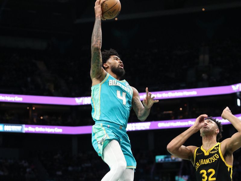 CHARLOTTE, NC - MARCH 29:  Nick Richards #4 of the Charlotte Hornets drives to the basket during the game against the Golden State Warriors on March 29, 2024 at Spectrum Center in Charlotte, North Carolina. NOTE TO USER: User expressly acknowledges and agrees that, by downloading and or using this photograph, User is consenting to the terms and conditions of the Getty Images License Agreement.  Mandatory Copyright Notice:  Copyright 2024 NBAE (Photo by Brock Williams-Smith/NBAE via Getty Images)