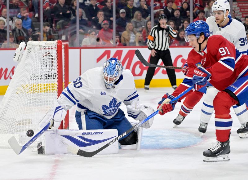 Nov 22, 2025; Montreal, Quebec, CAN; Toronto Maple Leafs goalie Joseph Woll (60) stops Montreal Canadiens forward Oliver Kapanen (91) during the second period at the Bell Centre. Mandatory Credit: Eric Bolte-Imagn Images