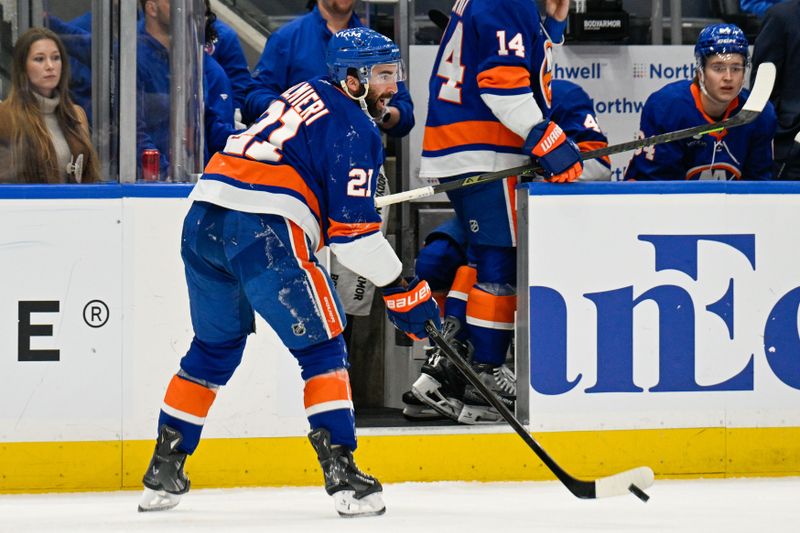 Nov 28, 2025; Elmont, New York, USA; New York Islanders center Kyle Palmieri (21) makes a pass after being injured against the Philadelphia Flyers during the second period at UBS Arena. Mandatory Credit: Dennis Schneidler-Imagn Images