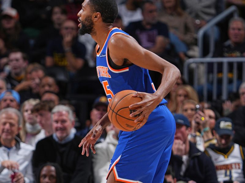 DENVER, CO - NOVEMBER 25: Mikal Bridges #25 of the New York Knicks dribbles the ball during the game against the Denver Nuggets on November 25, 2024 at Ball Arena in Denver, Colorado. NOTE TO USER: User expressly acknowledges and agrees that, by downloading and/or using this Photograph, user is consenting to the terms and conditions of the Getty Images License Agreement. Mandatory Copyright Notice: Copyright 2024 NBAE (Photo by Garrett Ellwood/NBAE via Getty Images)