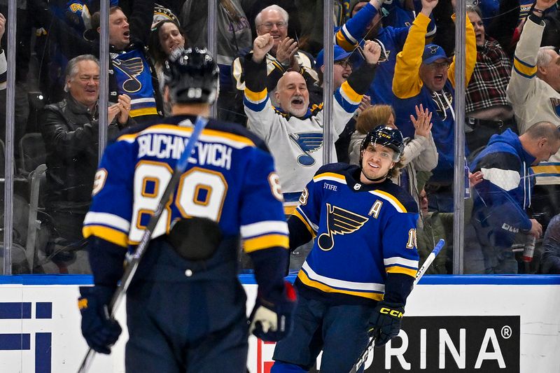 Dec 29, 2023; St. Louis, Missouri, USA;  St. Louis Blues center Robert Thomas (18) is congratulated by left wing Pavel Buchnevich (89) after scoring against the Colorado Avalanche during the first period at Enterprise Center. Mandatory Credit: Jeff Curry-USA TODAY Sports