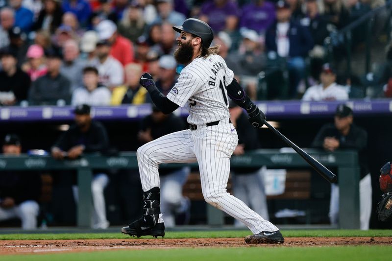 Aug 9, 2024; Denver, Colorado, USA; Colorado Rockies designated hitter Charlie Blackmon (19) hits an RBI single in the fourth inning against the Atlanta Braves at Coors Field. Mandatory Credit: Isaiah J. Downing-USA TODAY Sports